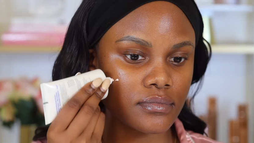 The Woman Is Applying Face Primer for A Long-Lasting Makeup Look